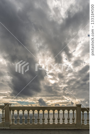 Storm clouds gathering view from the embankment to the sea, anticipation of a winter storm, vertical poster Storm clouds gathering view from the embankment to the sea, anticipation of a winter storm, vertical poster 133184500