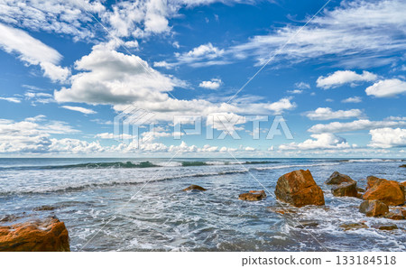seascape featuring a stormy sea and fallen rock fragments, a horizon with cumulus clouds, a concept of turbulent elements and the power of nature, copy space for natural projects seascape featuring a stormy sea and fallen rock fragments, a horizon with cumulus clouds, a concept of turbulent elements and the power of nature, copy space for natural projects 133184518