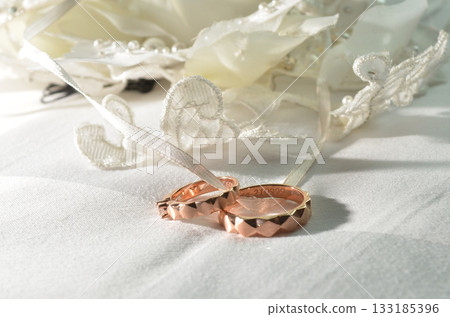 Elegant precious Diamond wedding Rings Resting On Surface With Blurred Backdrop For Wedding ceremony Elegant precious Diamond wedding Rings Resting On Surface With Blurred Backdrop For Wedding ceremony 133185396