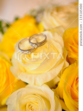 Elegant precious Diamond wedding Rings Resting On Surface With Blurred Backdrop For Wedding ceremony 133185400