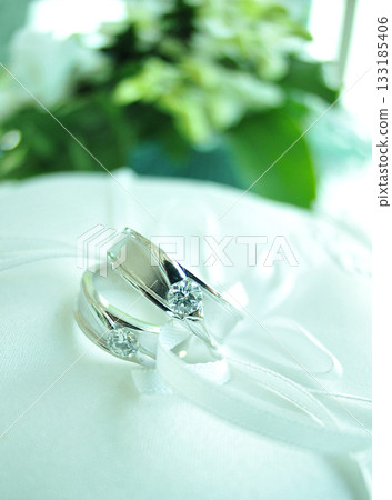 Elegant precious Diamond wedding Rings Resting On Surface With Blurred Backdrop For Wedding ceremony Elegant precious Diamond wedding Rings Resting On Surface With Blurred Backdrop For Wedding ceremony 133185406