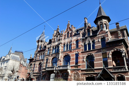 Grand Flemish Neo-Renaissance or Eclectic mansion with red brick facade, intricate arches, and towering turrets in neighborhood Zurenborg in Antwerp, Belgium Grand Flemish Neo-Renaissance or Eclectic mansion with red brick facade, intricate arches, and towering turrets in neighborhood Zurenborg in Antwerp, Belgium 133185586
