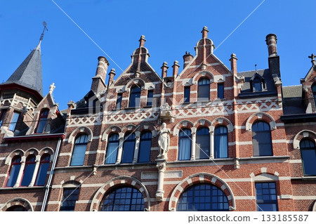 Grand Flemish Neo-Renaissance or Eclectic mansion with red brick facade, intricate arches, and towering turrets in neighborhoods Zurenborg in Antwerp, Belgium Grand Flemish Neo-Renaissance or Eclectic mansion with red brick facade, intricate arches, and towering turrets in neighborhoods Zurenborg in Antwerp, Belgium 133185587