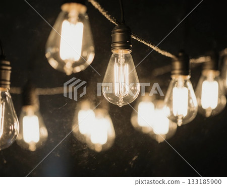 Soft glows from garland light bulbs create a cozy ambiance in dark surroundings, perfect for evening gatherings or special occasions Generative AI 133185900