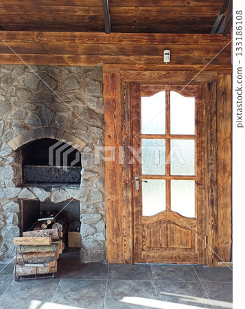 Inside tipical Ukrainian dacha. The stove and firewoods near it. country house 133186108