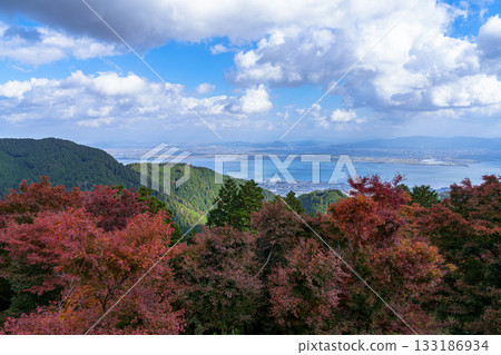 Oku-Hiei Driveway - View from the Hiei Mountain Pass Restaurant - Lake Biwa and the Omi Mountains seen through the autumn leaves① Oku-Hiei Driveway - View from the Hiei Mountain Pass Restaurant - Lake Biwa and the Omi Mountains seen through the autumn leaves① 133186934