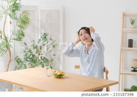 A woman who does not like vegetables A woman who does not like vegetables 133187396