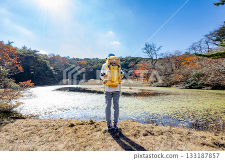 Mountain climbing in autumn 133187857