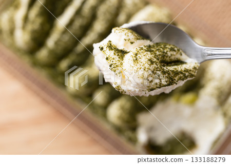 Matcha Tiramisu cake with green tea powder on top, Italian dessert fusion with Japanese Matcha Tiramisu cake with green tea powder on top, Italian dessert fusion with Japanese 133188279