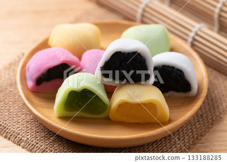 Daifuku mochi stuffed with soybean, matcha green tea, sesame seed and red bean paste 133188285