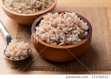 Cooked Thai brown rice in a wooden bowl, Healthy eating Cooked Thai brown rice in a wooden bowl, Healthy eating 133188312