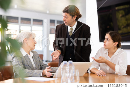 Group of businesspeople having meeting in an office 133188945