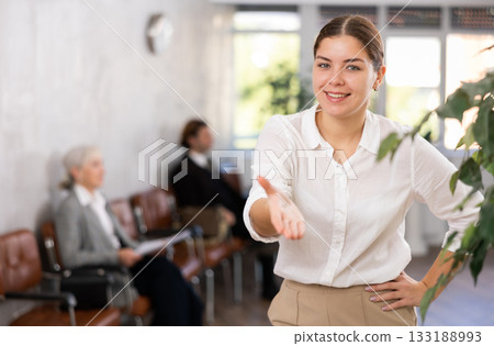 Young woman in business clothes posing in office 133188993