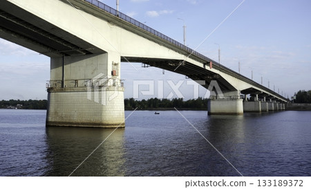 Concrete road bridge spanning a wide river. Clip 133189372