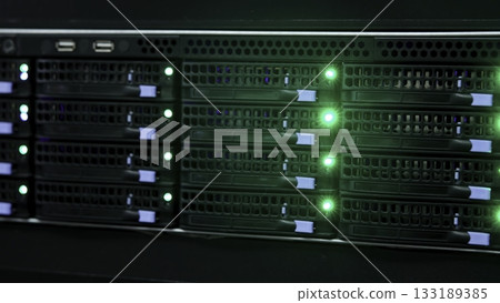 Server rack blinking green lights in data center. Media 133189385
