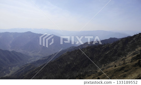 Majestic mountain range panorama under a clear blue sky. Media 133189552