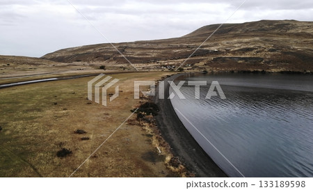 Scenic aerial flight over patagonia lake and road. Media Scenic aerial flight over patagonia lake and road. Media 133189598