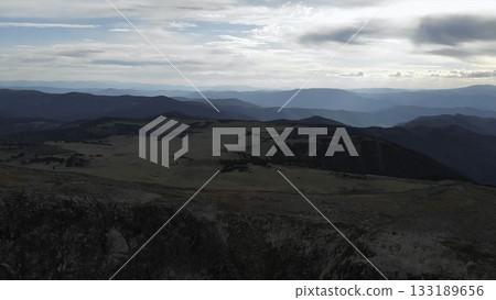 Dramatic aerial view of a vast mountain range landscape. Media 133189656