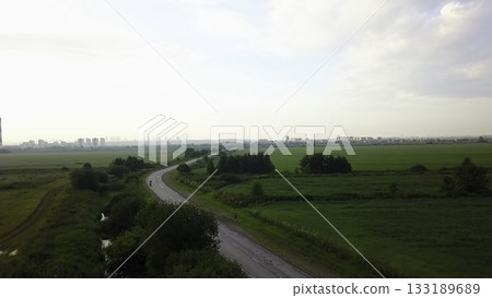 Aerial view of motorcycle riding on country road. Clip 133189689