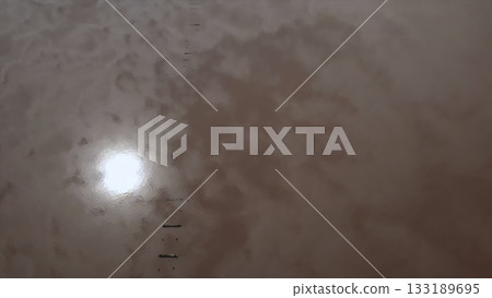 Aerial view of people walking on pink salt lake. Media Aerial view of people walking on pink salt lake. Media 133189695