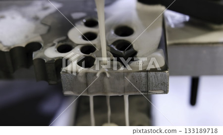Industrial laser cutting metal, generating sparks and molten metal. Media 133189718