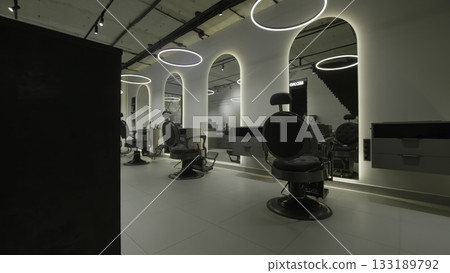 Modern barbershop interior with stylish chairs. Clip 133189792