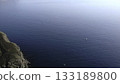 Aerial view of fishing boats sailing in deep blue ocean near the coast. Media 133189800