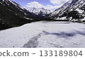 A breathtaking and beautiful snowy mountain landscape that features a stunning frozen lake. Media 133189804