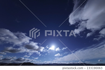 Dynamically spread clouds in the refreshing blue sky. Winter. Ultra-wide angle. Sky-focused. 240226am. Dynamically spread clouds in the refreshing blue sky. Winter. Ultra-wide angle. Sky-focused. 240226am. 133190063