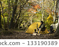 A man enjoying solo camping in autumn 133190389