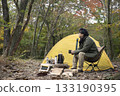 A man enjoying solo camping in autumn 133190395