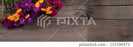 Colorful Floral Composition on Rustic Wooden Background with Copy Space 133190873