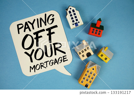 Pay Off Mortgage text with house models on blue background 133191217