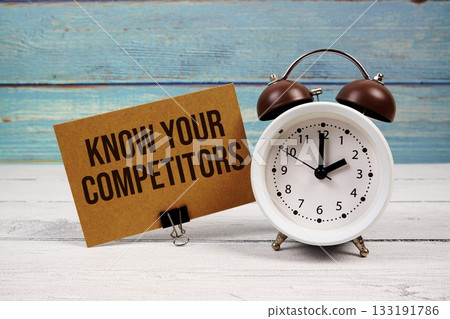 Know Your Competitors text written on paper card with alarm clock on wooden background Know Your Competitors text written on paper card with alarm clock on wooden background 133191786
