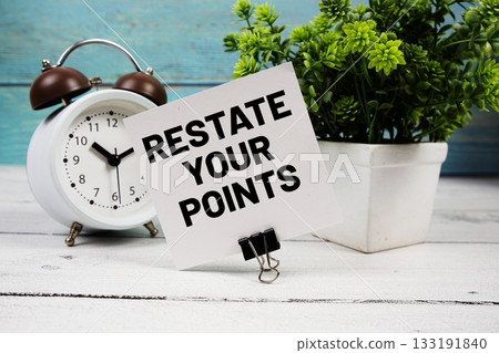 Restate Your Points text written on paper card with alarm clock on wooden background Restate Your Points text written on paper card with alarm clock on wooden background 133191840