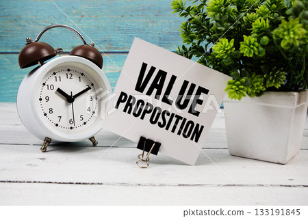 Value Proposition text written on paper card with alarm clock on wooden background Value Proposition text written on paper card with alarm clock on wooden background 133191845