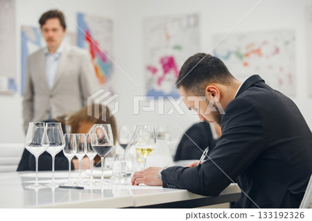 Sommelier examination to get certificate professional work of winemaking. Blind wine tasting. Sommelier degustate wine. Sommelier examination to get certificate professional work of winemaking. Blind wine tasting. Sommelier degustate wine. 133192326