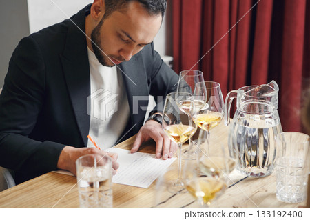 Sommelier degustate wine. Training of restaurant staff, studying alcohol list. Blind wine tasting. Sommelier degustate wine. Training of restaurant staff, studying alcohol list. Blind wine tasting. 133192400