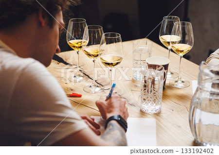 Sommelier examination to get certificate professional work of winemaking. Sommelier degustate wine. 133192402