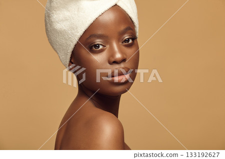 Portrait of Afro ethnicity smiling girl with natural make-up. 133192627