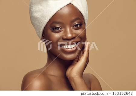 Black woman enjoying result of beauty skin care procedures. 133192642