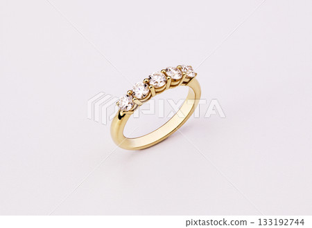 A gold ring with five diamonds on it A gold ring with five diamonds on it 133192744