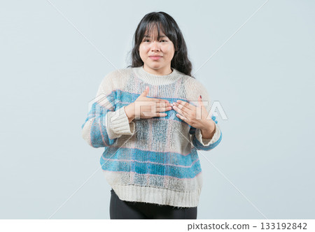 Asian girl gesturing GRATITUDE in sign language. Young woman making gesture GRATEFUL in sign language isolated Asian girl gesturing GRATITUDE in sign language. Young woman making gesture GRATEFUL in sign language isolated 133192842