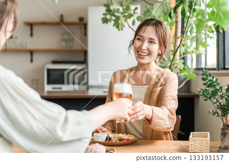 Young Asian women having a girls' party at a cafe or home (daytime drinking, beer, toasting, relaxing) 133193157