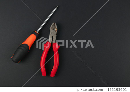 Tools arranged on a black surface for a DIY project Tools arranged on a black surface for a DIY project 133193601