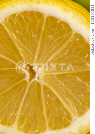 sliced juicy yellow sour lemon lying on the table with green limes, sliced ripe fruits lemon and limes are lying on a wooden table sliced juicy yellow sour lemon lying on the table with green limes, sliced ripe fruits lemon and limes are lying on a wooden table 133193851