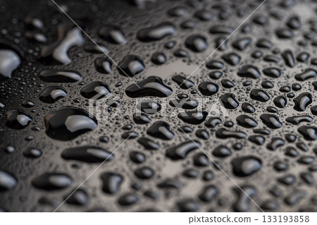 black and white glass surface in water drops close up, wet mirrored black glass in a large number of water droplets black and white glass surface in water drops close up, wet mirrored black glass in a large number of water droplets 133193858
