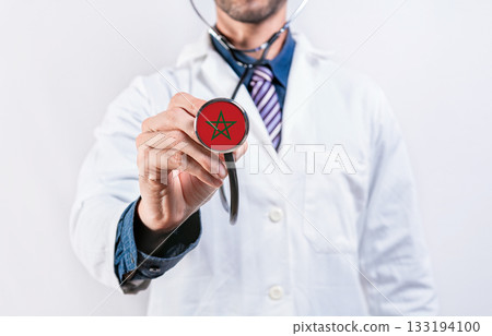 Morocco healthcare system, doctor holding stethoscope. Morocco health and medical insurance concept Morocco healthcare system, doctor holding stethoscope. Morocco health and medical insurance concept 133194100