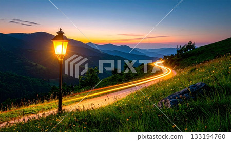 A fantastic night scene with trails of light and lanterns shining across the mountain sunset. 133194760