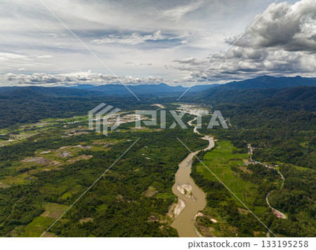 Aerial view of valley with farmland and rice fields in the highlands. Sumatra, Indonesia. Aerial view of valley with farmland and rice fields in the highlands. Sumatra, Indonesia. 133195258